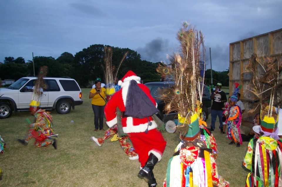 Santa Claus dancing with masqueraders